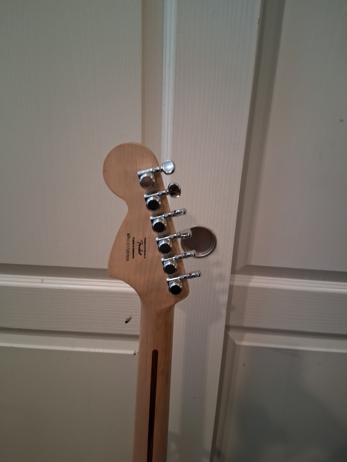 Back of Squier headstock and locking tuners